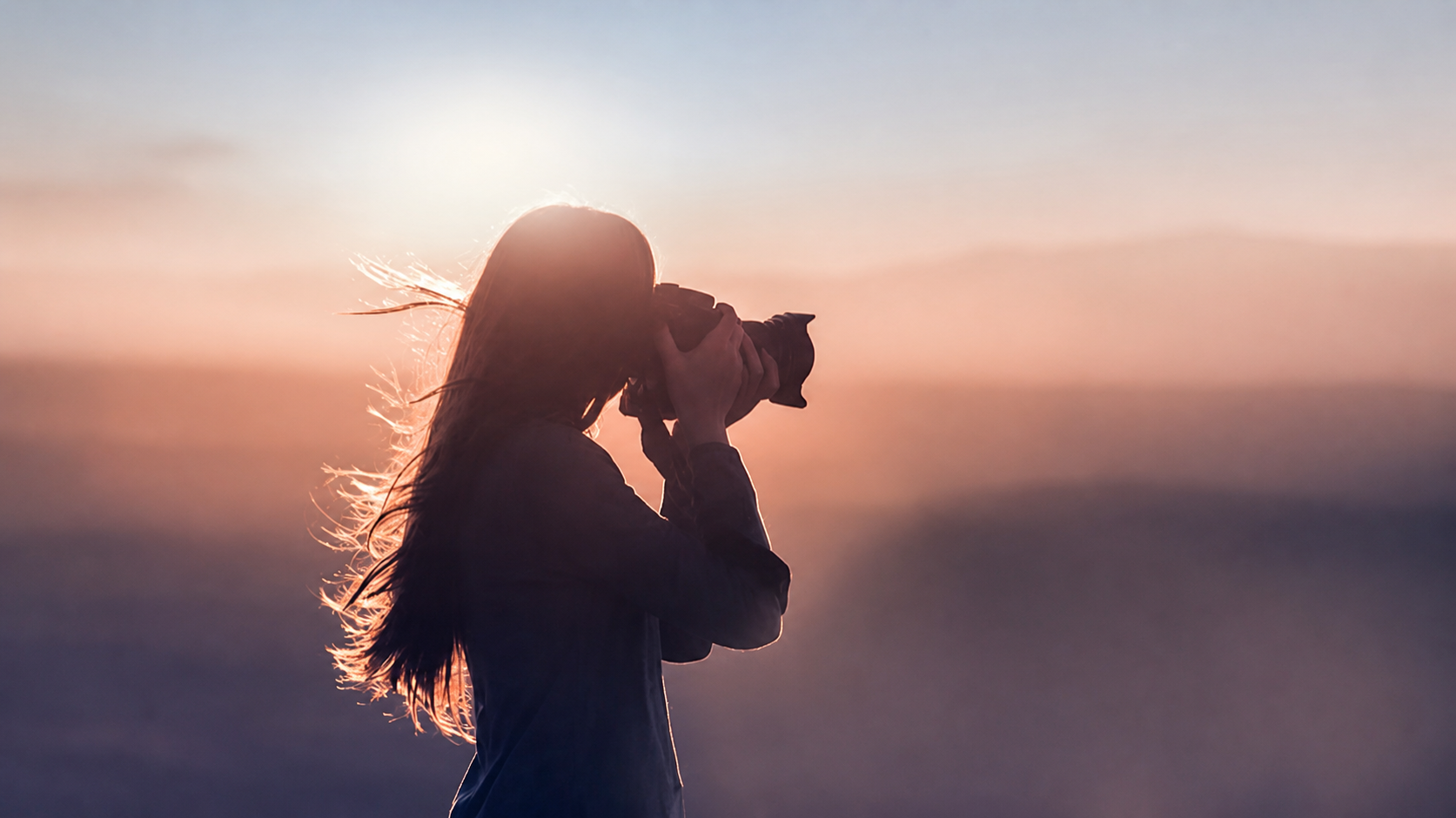 Photographer shooting at sunset